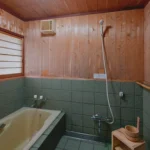 Bath room in a traditional thatched roof house in Miyama Kyoto