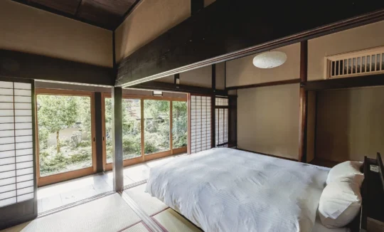 king bed bedroom in Hotaruan thatched house Miyama Kyoto