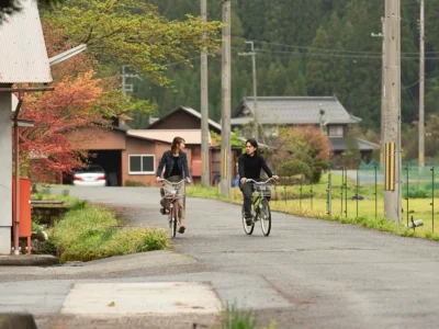 Cycling through Miyama village between traditional houses Kyoto