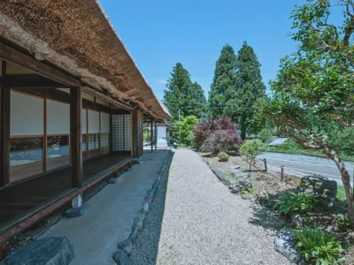 Traditional fukiotoshi thatched roof farmhouse exterior in Miyama Kyoto