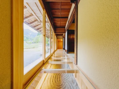 Glass veranda engawa overlooking the river at Obatake thatched house Miyama Kyoto