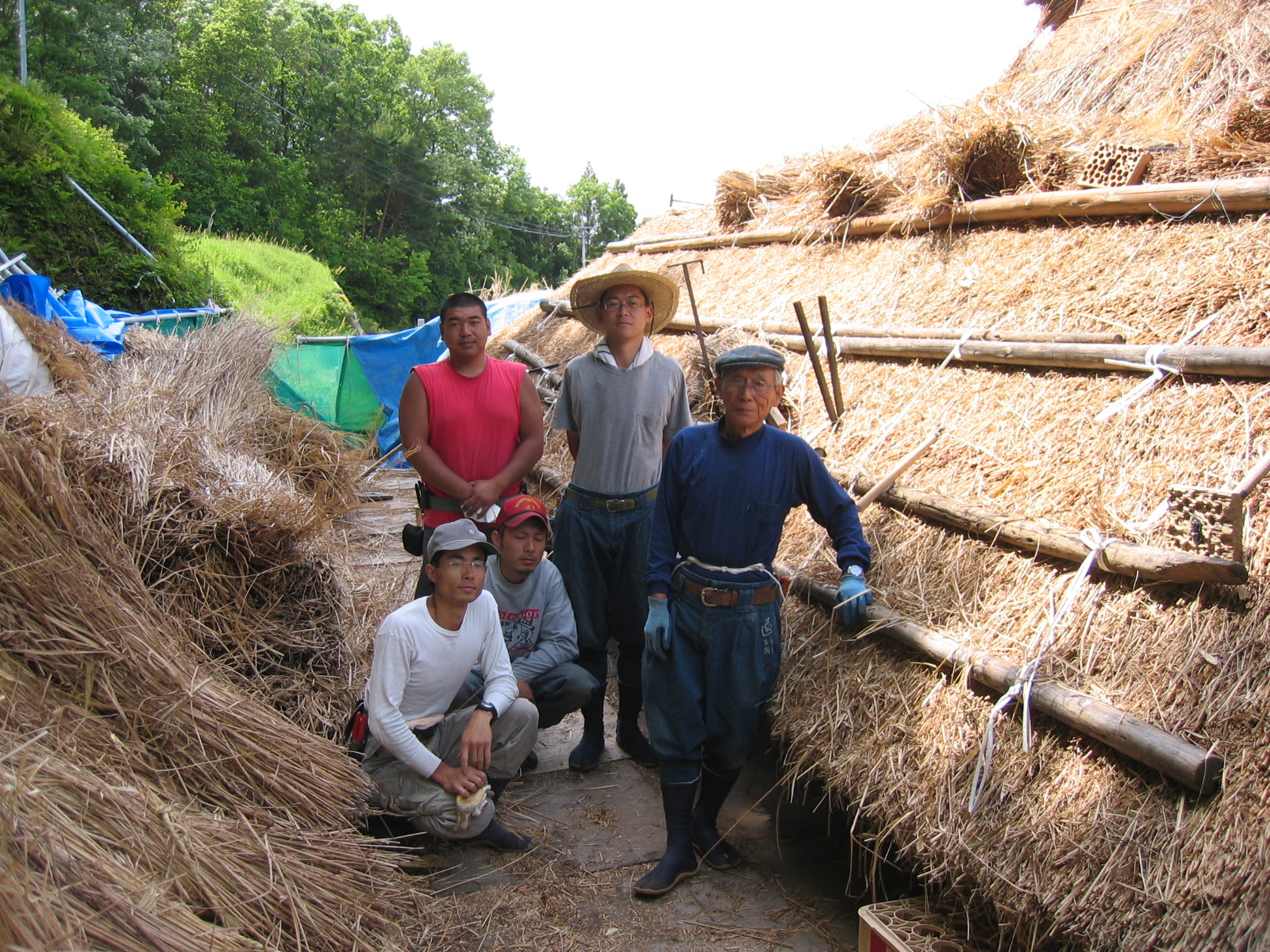 Master thatcher Masashi Okamoto with young thatchers in Okayama, Japan