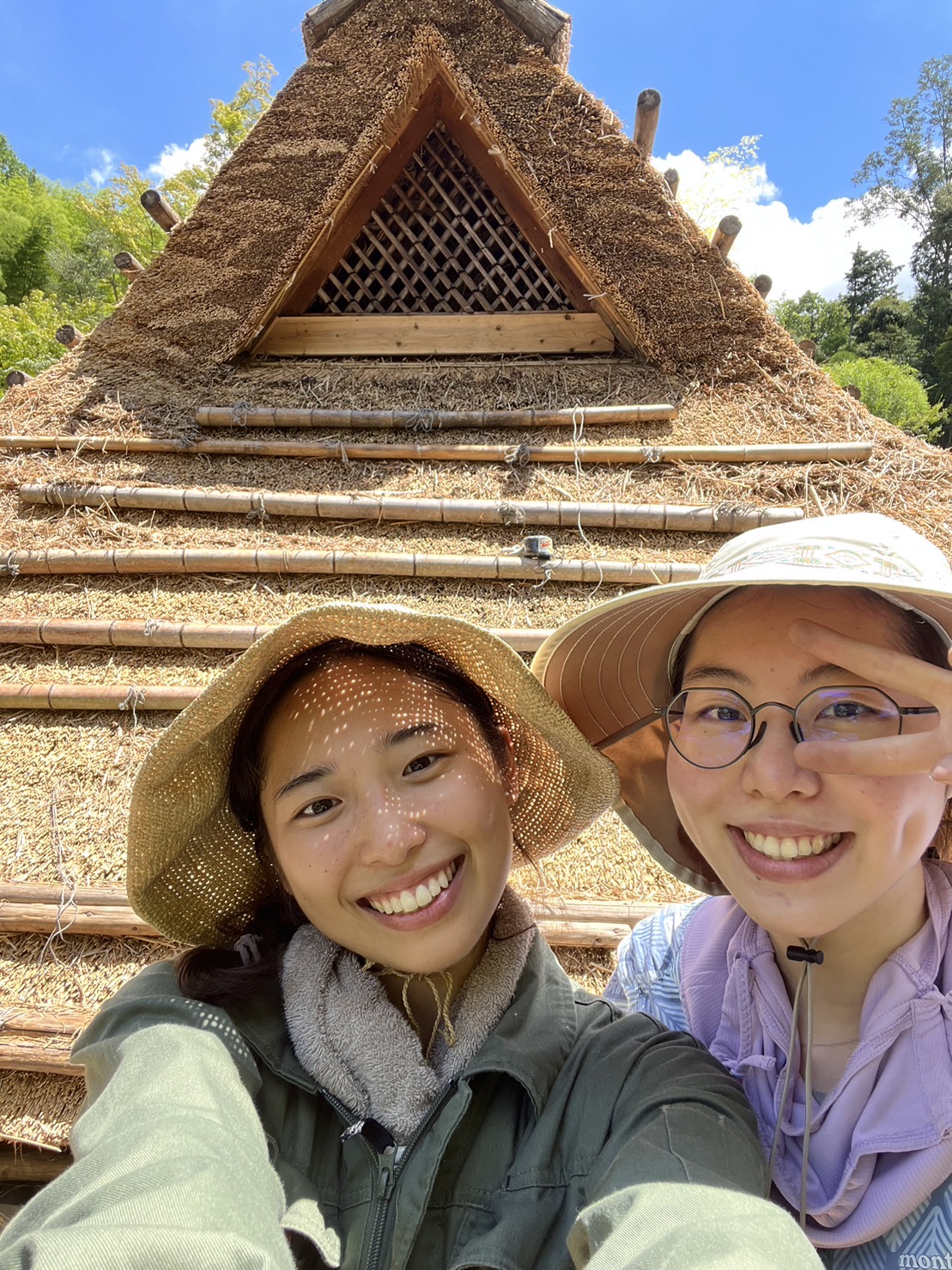 Young workers at a traditional thatched roof work site in Japan