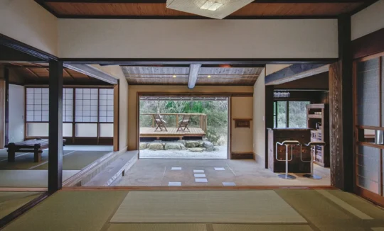 Tatami room and doma interior looking out to nature in EISA thatched house Miyama Kyoto