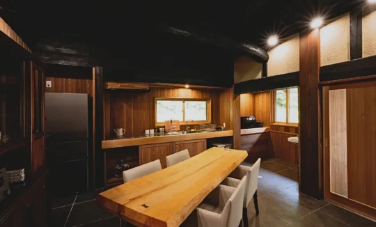 Kitchen and dining area in the main house of Obatake thatched farmhouse Miyama Kyoto