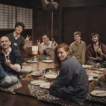 Foreign travelers enjoying hot pot at an irori hearth in Miyama Kyoto