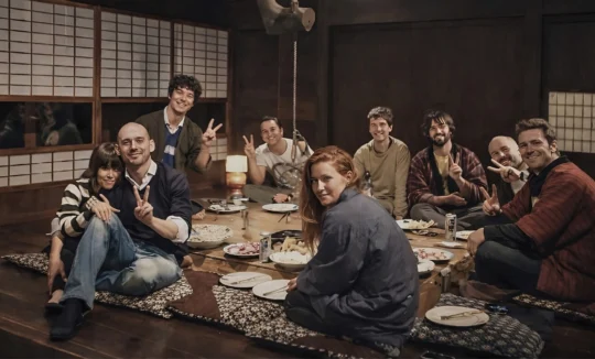 Foreign travelers enjoying hot pot at an irori hearth in Miyama Kyoto