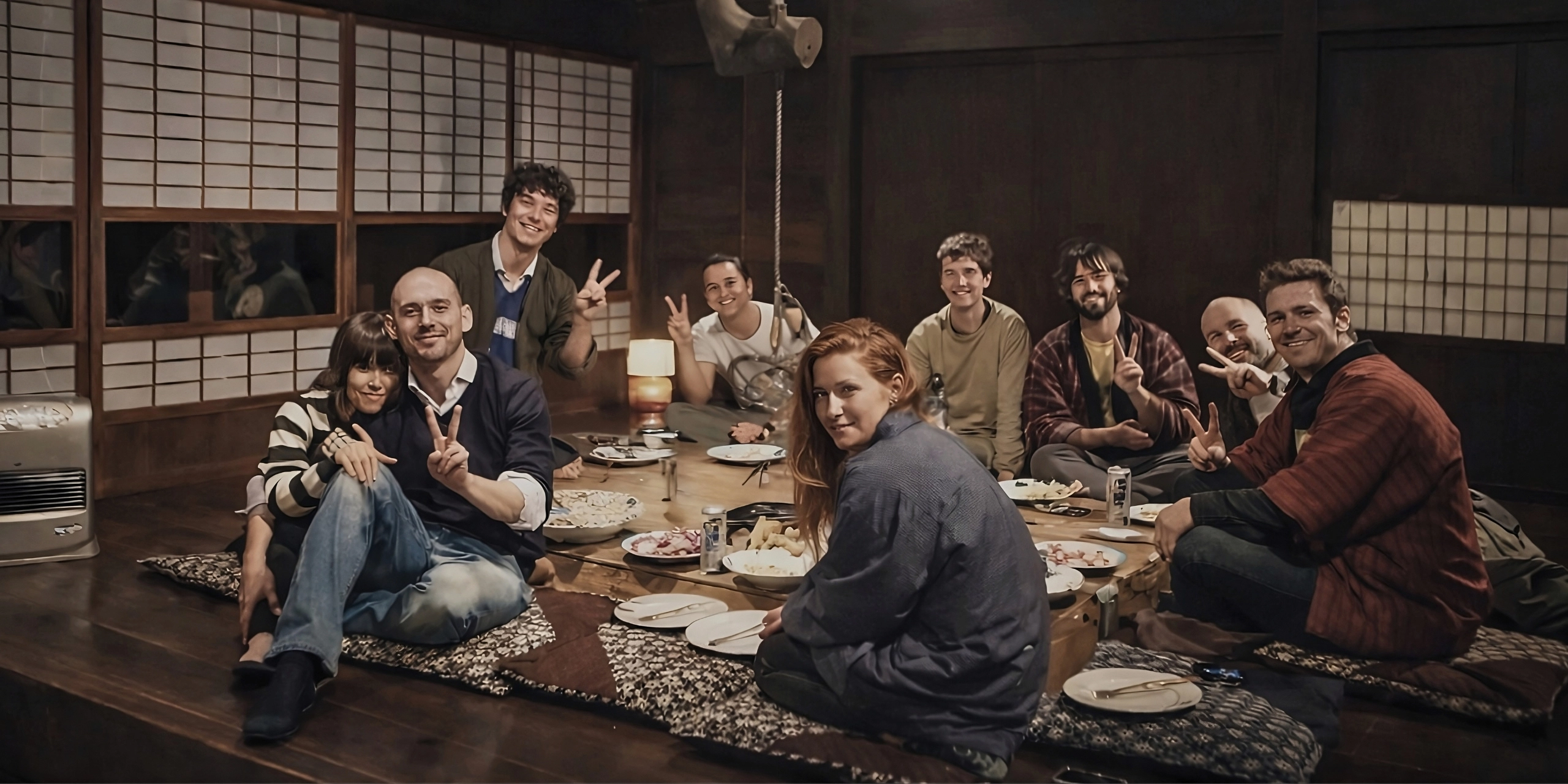 Foreign travelers enjoying hot pot at an irori hearth in Miyama Kyoto
