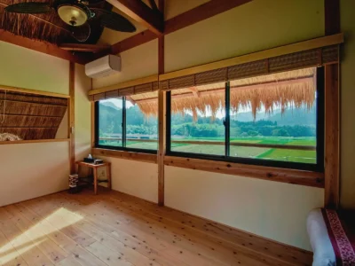 second floor panoramic countryside view from thatched roof villa in Miyama Kyoto