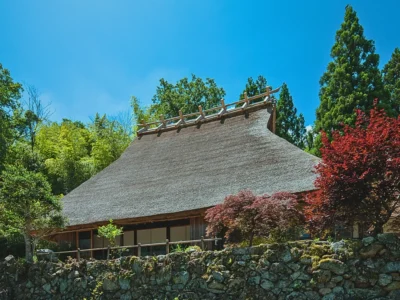Exterior of Mitoya traditional thatched farmhouse on elevated ground Miyama Kyoto