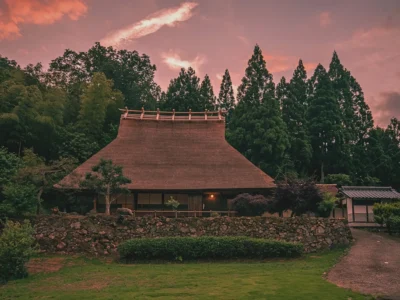 Evening view of Mitoya thatched farmhouse at sunset Miyama Kyoto
