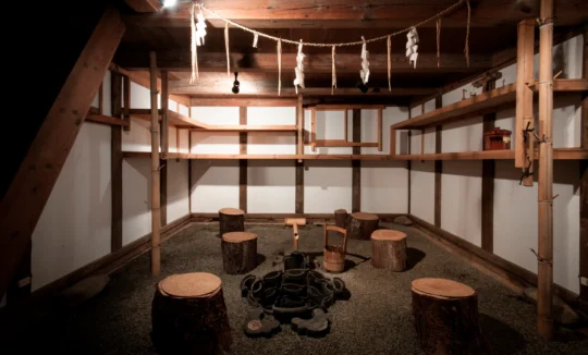 Traditional suikinkutsu water instrument inside a Japanese storehouse in Miyama Kyoto