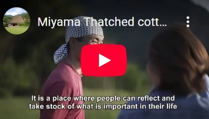 Founder Haruo Nishio speaking about Miyama and thatched-roof culture