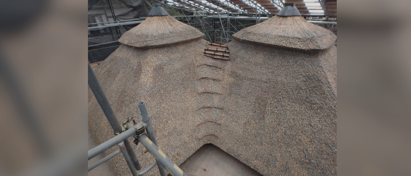 Traditional thatched-roof pavilion in Kenrokuen Garden, Kanazawa, Japan