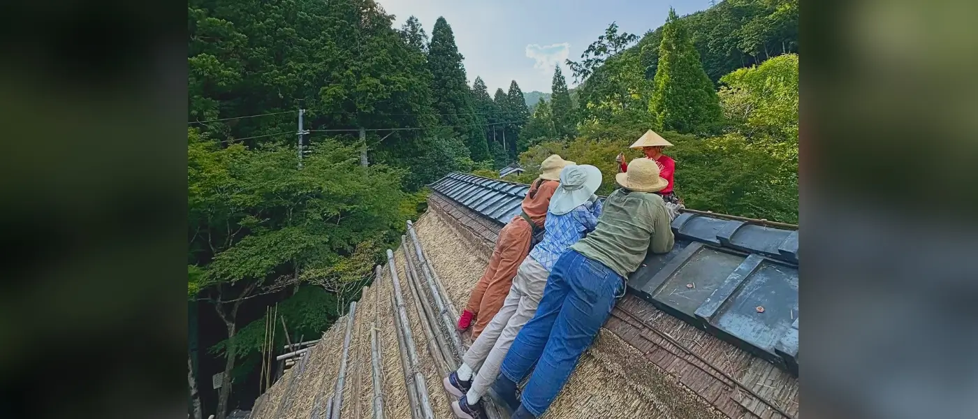 View of a traditional thatched-roof village seen along a clear line of sight