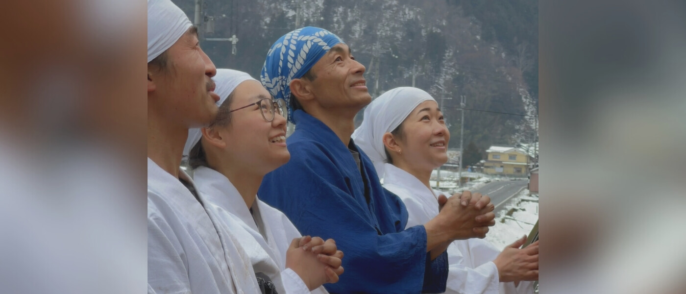Master thatcher praying before beginning work on a traditional thatched roof