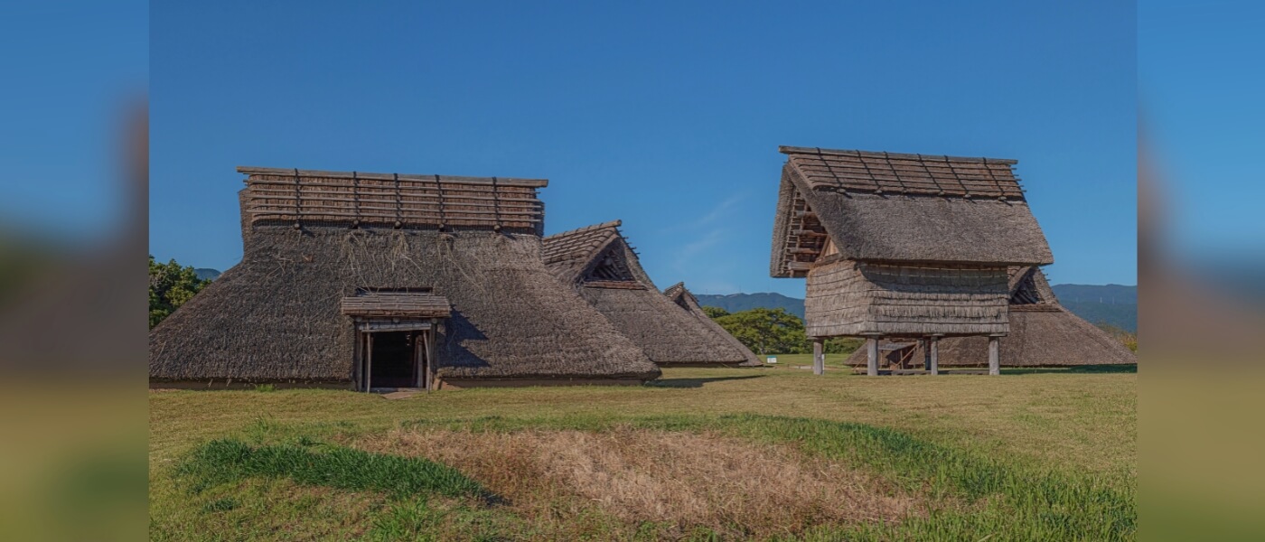 Reconstructed thatched-roof houses at Yoshinogari archaeological site in Japan